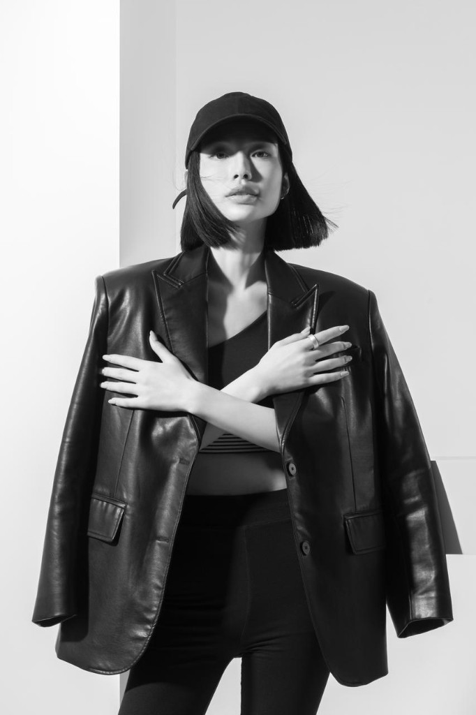 日月健 editorial portrait — leather blazer and ring detail